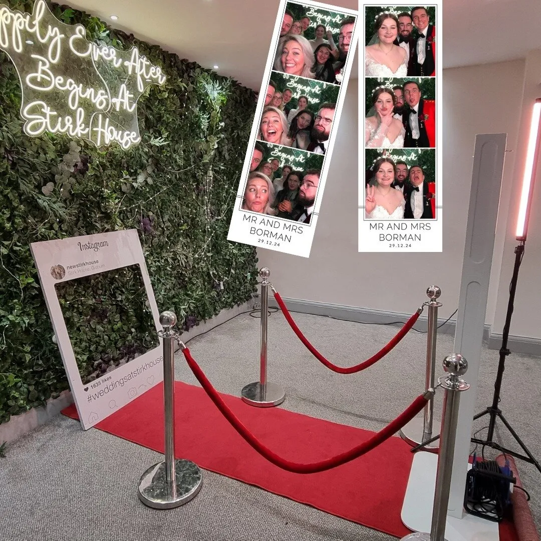 Wedding photo booth with greenery wall at Stirk House